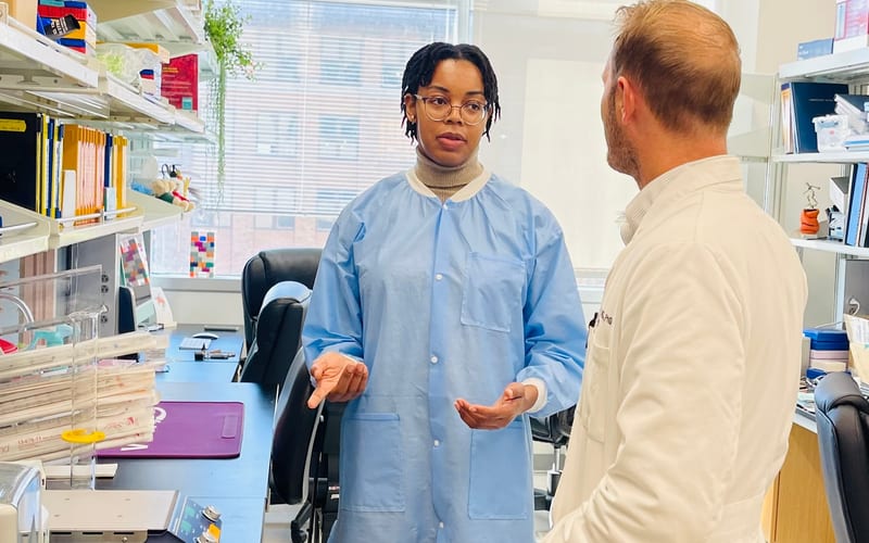 Diverse research team collaborating in the laboratory
